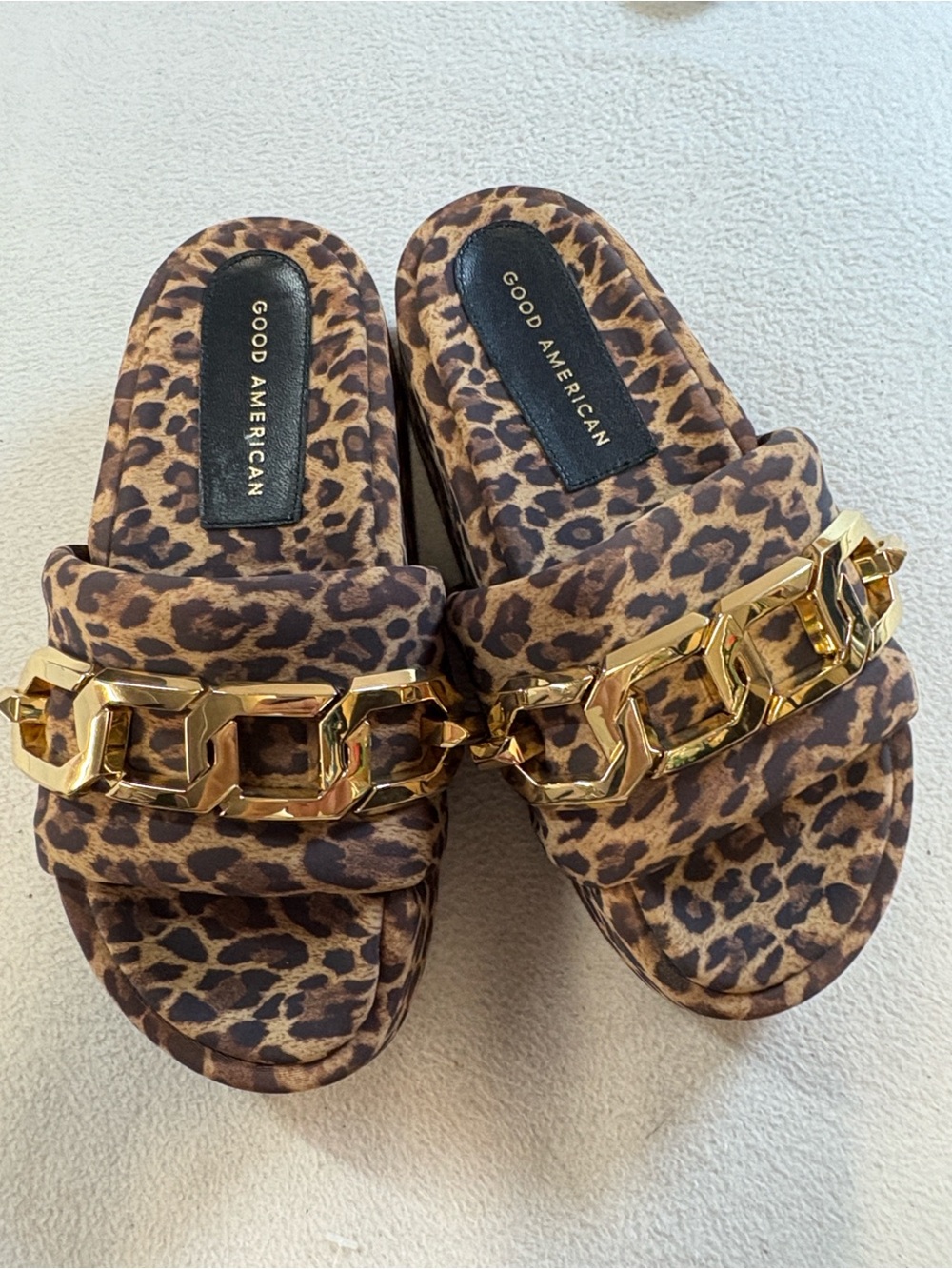 Good American Leopard-Print Slide Sandals with Gold Chain Accent